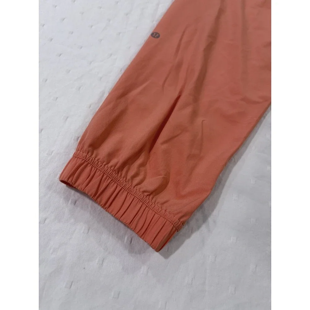 Lululemon Tear-Away Mid-Rise Track Pant Size 6 Coral Kiss Orange Swift LW5GAXS